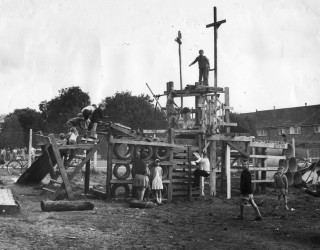 Children playing on a wooden climbing structure at Bandley Hill Adventure | Stevenage Museum/Donne Buck