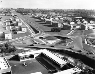 roundabout at junction of St George's Way, Six Hills Way and Monkswood Way - taken from roof of Southgate House - with an overview of roads, cycle paths, housing at Walden End and police station yard, etc | Stevenage Museum